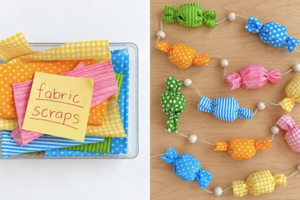 DIY candy garland beside a clear bin of fabric scraps, the colorful fabric candies strung with wooden beads on a wood table