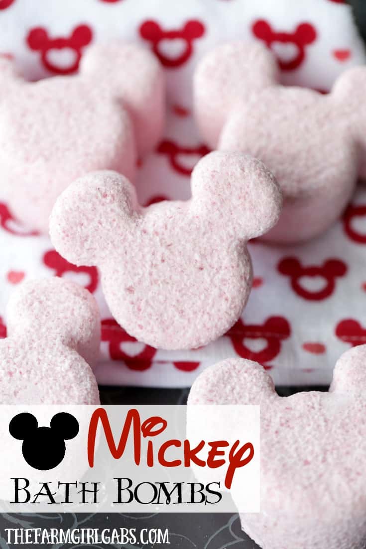 Mickey Mouse bath bombs, pale pink Mickey head shaped bath bombs on a red and white Mickey print cloth