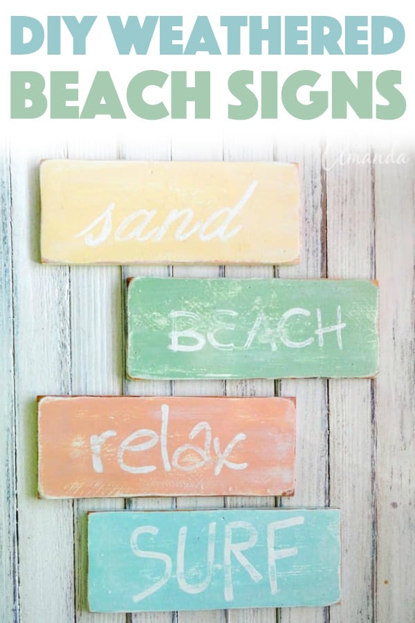 Weathered beach signs painted in soft coastal colors reading surf, relax, beach and sand, distressed DIY wood slat decor