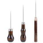 Three awls with wooden handles, a tool for poking evenly spaced holes in cardstock before embroidery