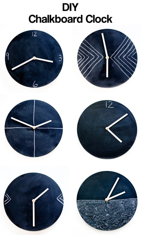 Six round black chalkboard paint clocks with white hands, each with a different hand-drawn chalk number design or pattern