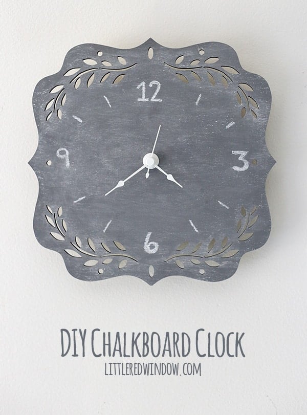 Gray chalkboard paint wall clock on a scalloped wood plaque with cutout leaf corners, chalk numbers and white clock hands