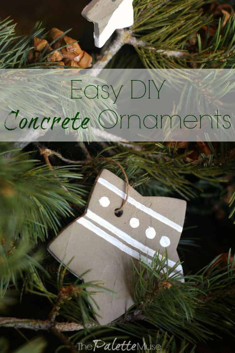 Easy Concrete Ornaments | Cookie Cutter Christmas DIY Gray concrete star ornament with white painted stripes and dots hanging on a pine branch, under an Easy DIY title