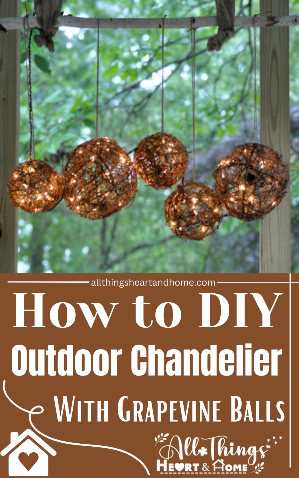 Easy DIY porch light, five grapevine balls glowing with warm fairy lights, hanging from a branch above a leafy garden