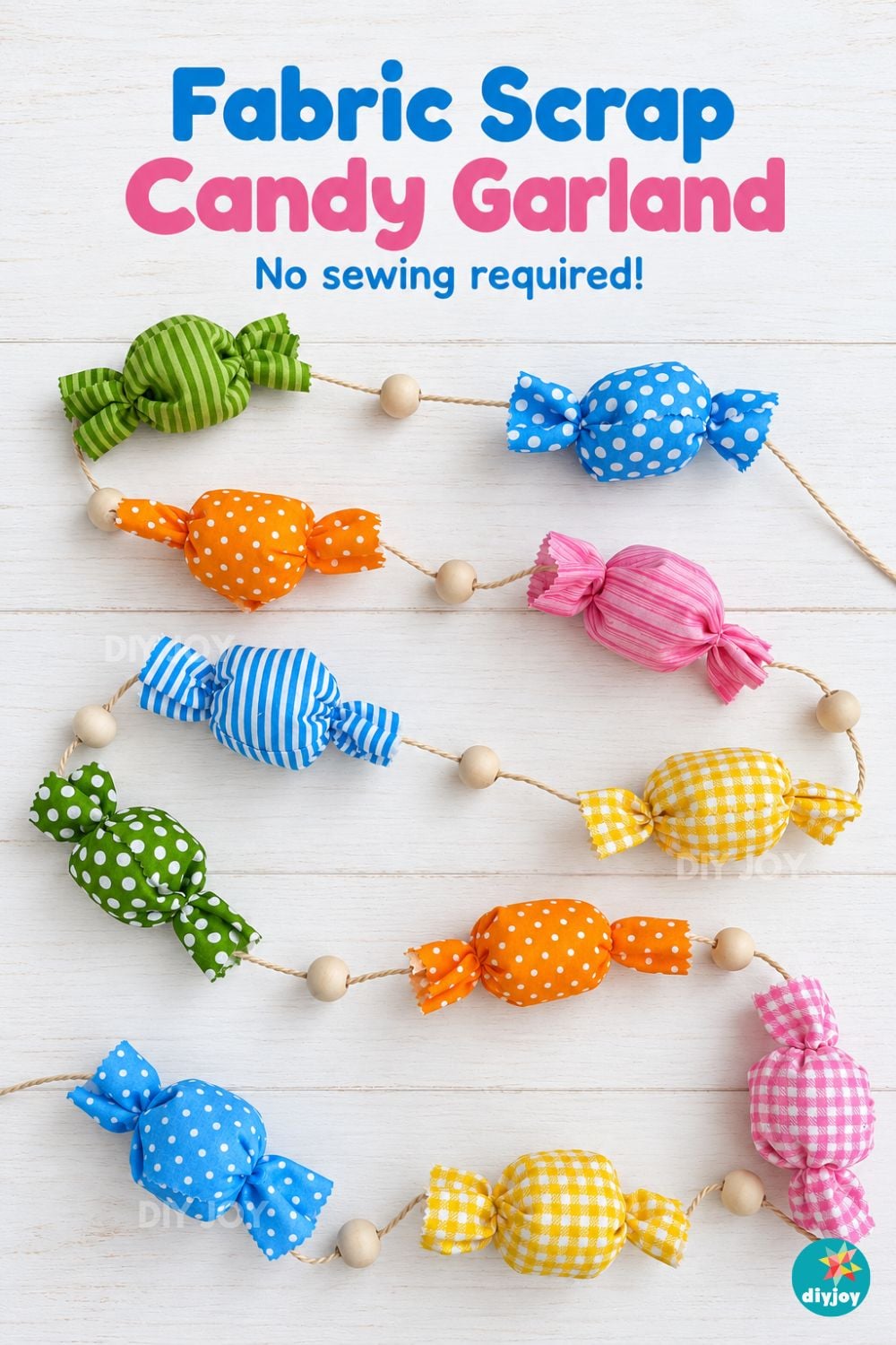 Fabric scrap candy garland pin with bright gingham, striped and polka dot candies and wooden beads on white wood planks