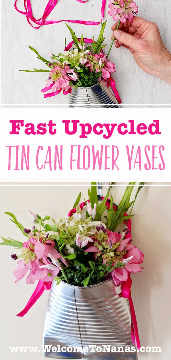Hanging Tin Can Flower Vases | Tin Can Idea Hanging tin can flower vase with a flattened bottom and a twine handle, filled with fresh flowers and hung on a door
