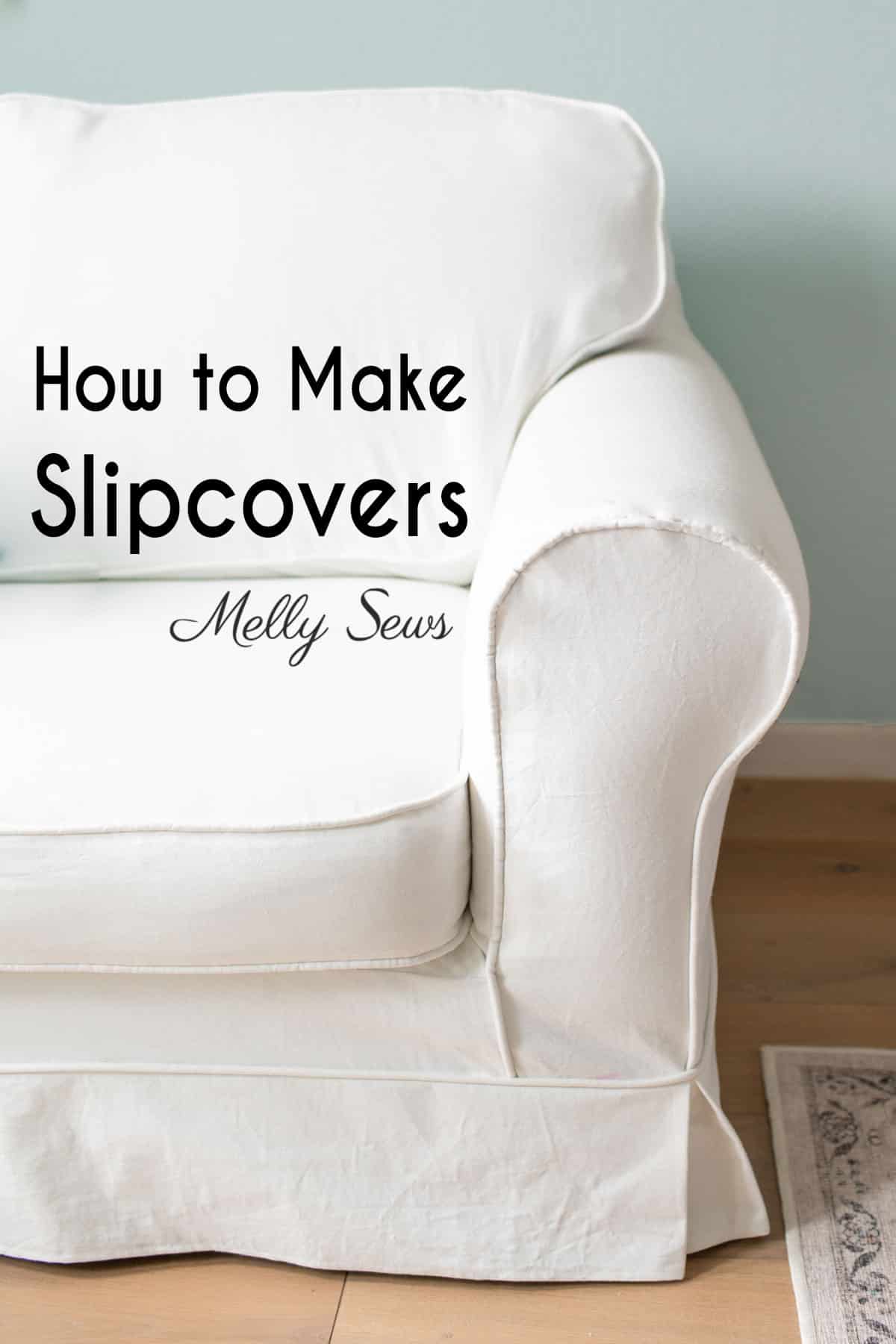 How to Sew a Slipcover for a Couch or Chair | Home Sewing Project White canvas slipcover with piped seams fitted over a rolled arm chair in a bright room with a pale blue wall