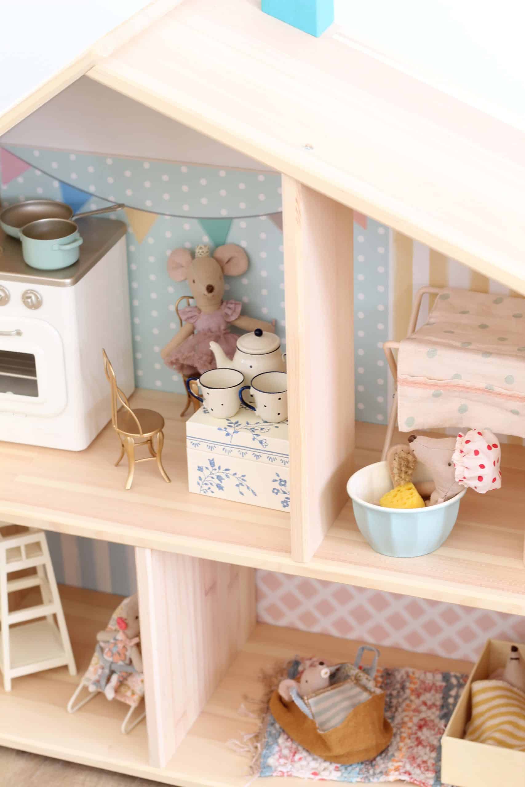 IKEA Flisat wooden dollhouse with pastel wallpaper, tiny stove, teapot, mouse figures and miniature furniture in each room