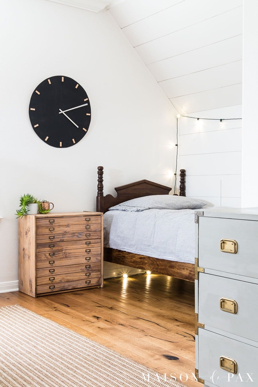 IKEA Rast Printer's Cabinet Nightstand | IKEA Bedroom Hack IKEA Rast dresser stained warm brown with faux skinny map drawers and library pulls used as a nightstand beside a wood bed