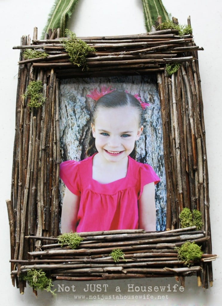 Twig and moss Easter frame, a rectangle frame covered in glued twigs with green moss and a small nest of blue eggs