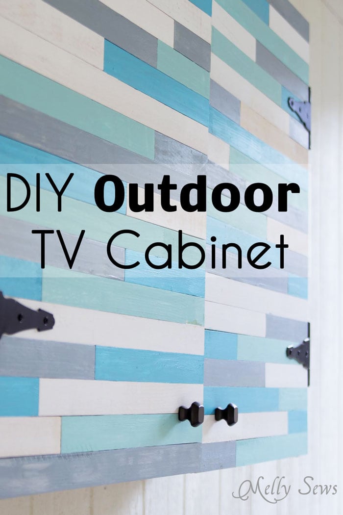 Outdoor TV Cabinet | DIY Media Room Idea Outdoor TV cabinet doors covered in random white, blue, teal and gray painted lattice strips with black hinges