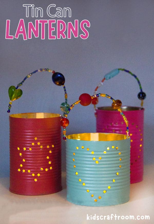 Punched Tin Can Lanterns with Beaded Handles | Tin Can Idea Painted tin can lanterns with punched heart designs, beaded wire handles and battery tea lights glowing inside each one