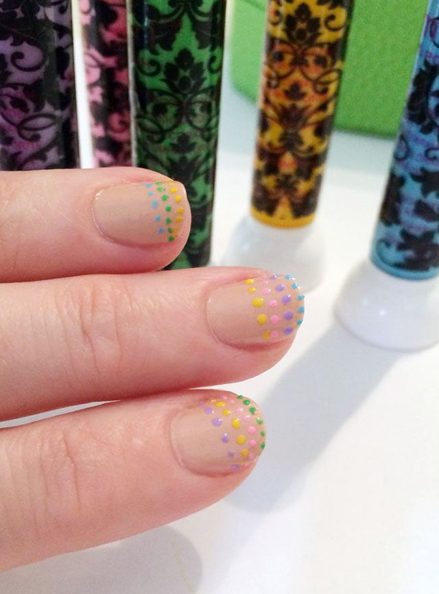 Rainbow Dotted French Tip Nails | Quick Nail Art Idea Rainbow dotted French tip nails with rows of tiny pastel yellow, pink, purple, blue and green dots on a nude manicure