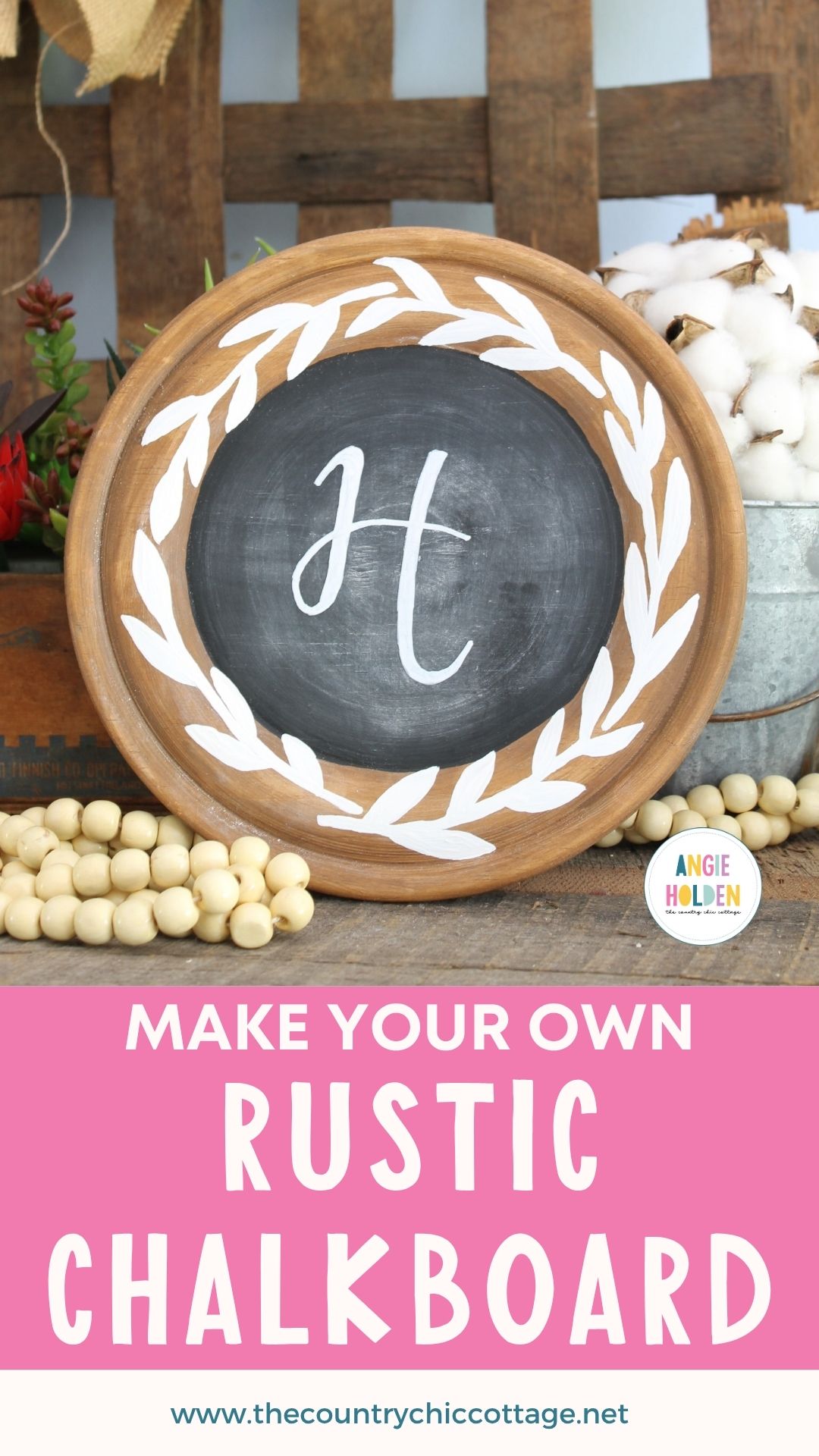 Round wood plate chalkboard with a stained rim, a white painted leaf wreath and a script letter H monogram in the center