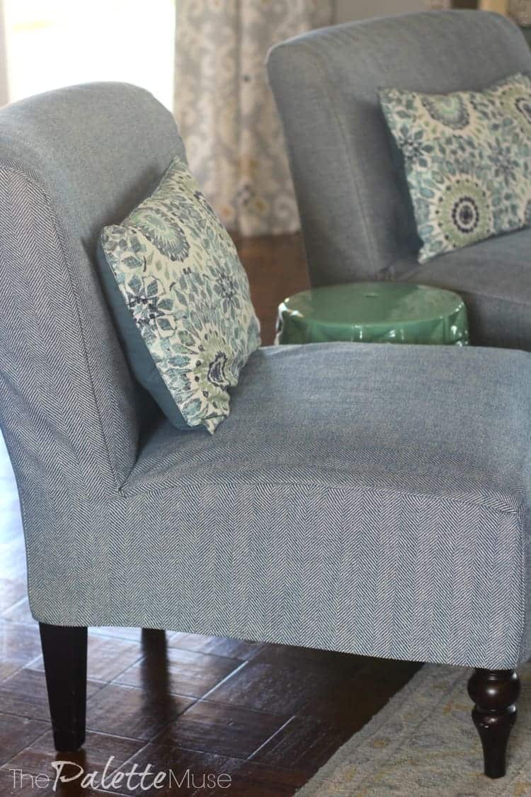 Simple Slipcover Chair Covers | Home Sewing Project Gray armless chairs in simple sewn chair covers with blue and green patterned throw pillows in a living room