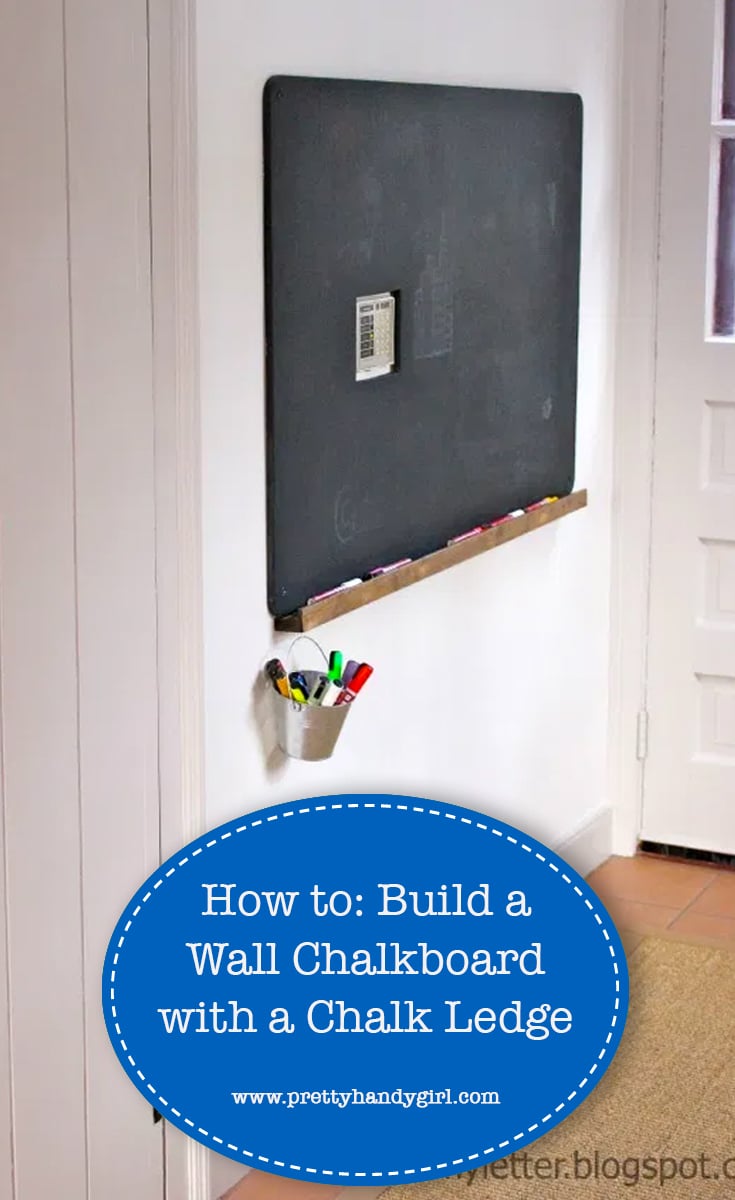 Black wall chalkboard with a stained wood chalk ledge and a small galvanized pail of chalk markers hanging below it