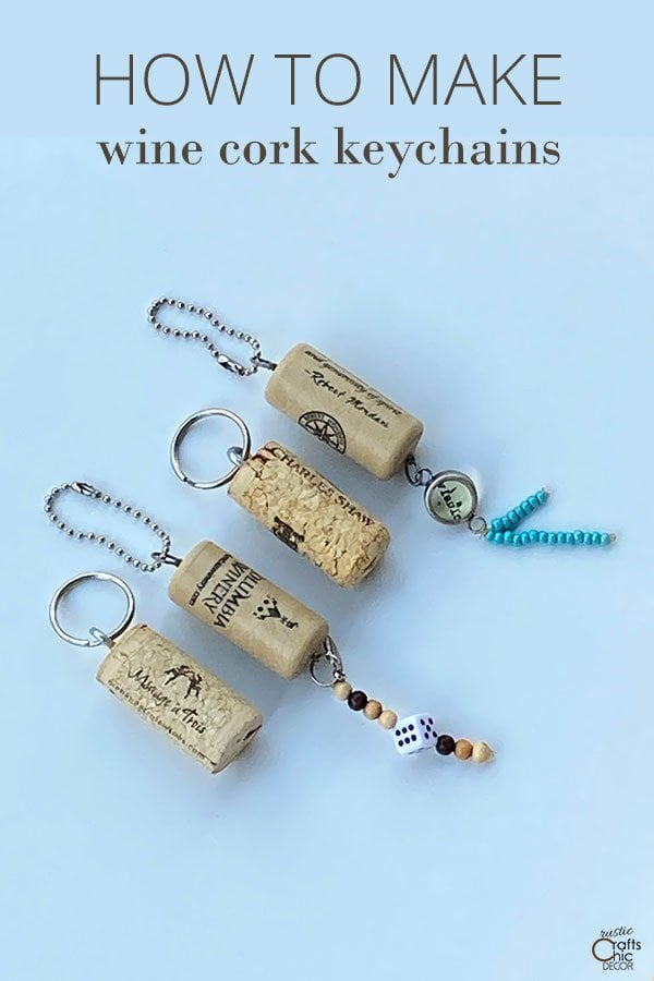 Four wine cork keychains with silver key rings, ball chains, beads and a dice charm on light blue with title text