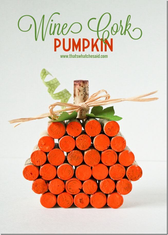Wine cork pumpkin decor with orange painted cork ends, a cork stem, green paper leaves and a raffia bow under title text