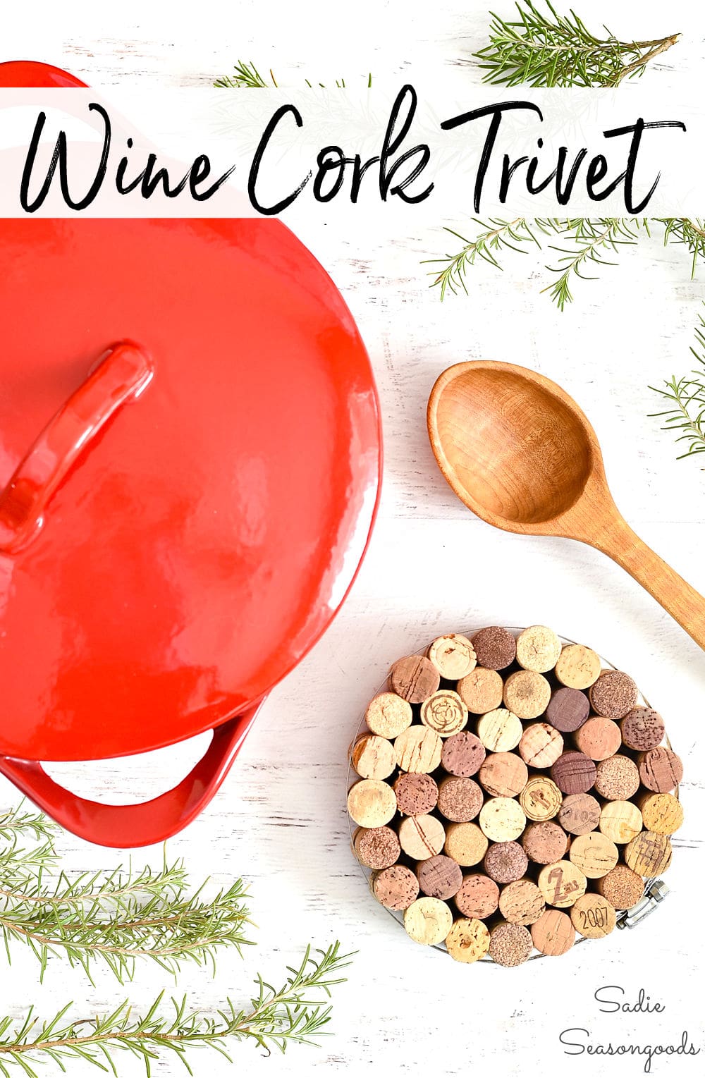 Wine cork trivet, a round trivet of packed corks held by a steel hose clamp beside a red Dutch oven lid and wooden spoon