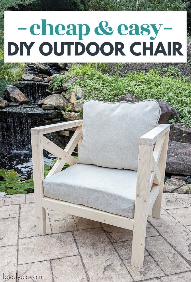 X Arm Outdoor Chair | DIY Patio Furniture Idea White wood outdoor armchair with X shaped arms and a gray cushion on a stone patio in front of a garden waterfall